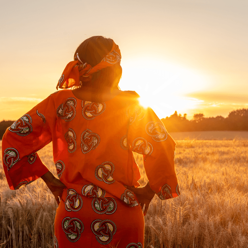 Woman staring over field