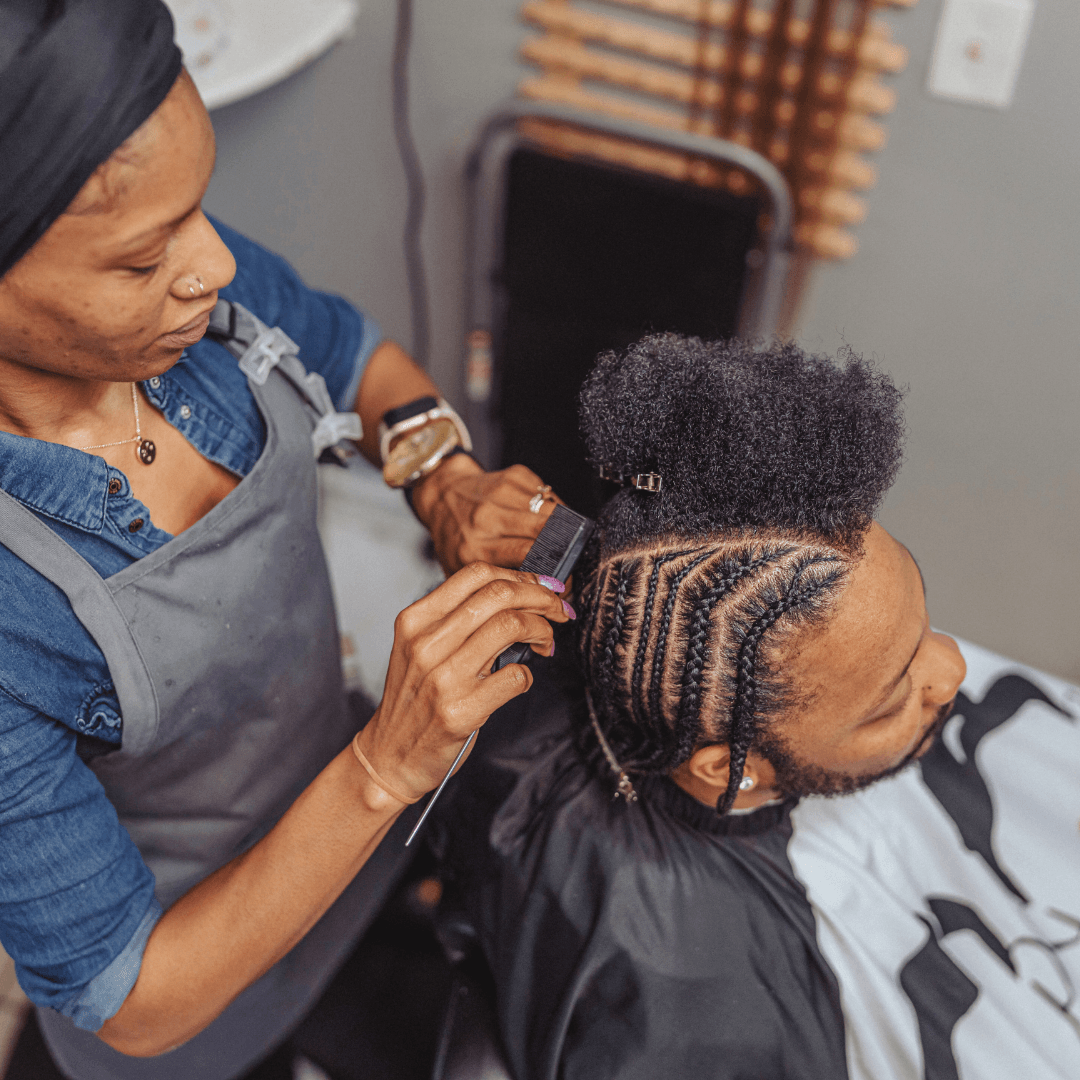 woman braiding man's hair